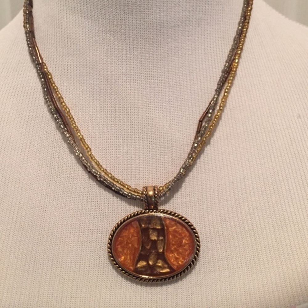 Triple strand beaded necklace and pendant